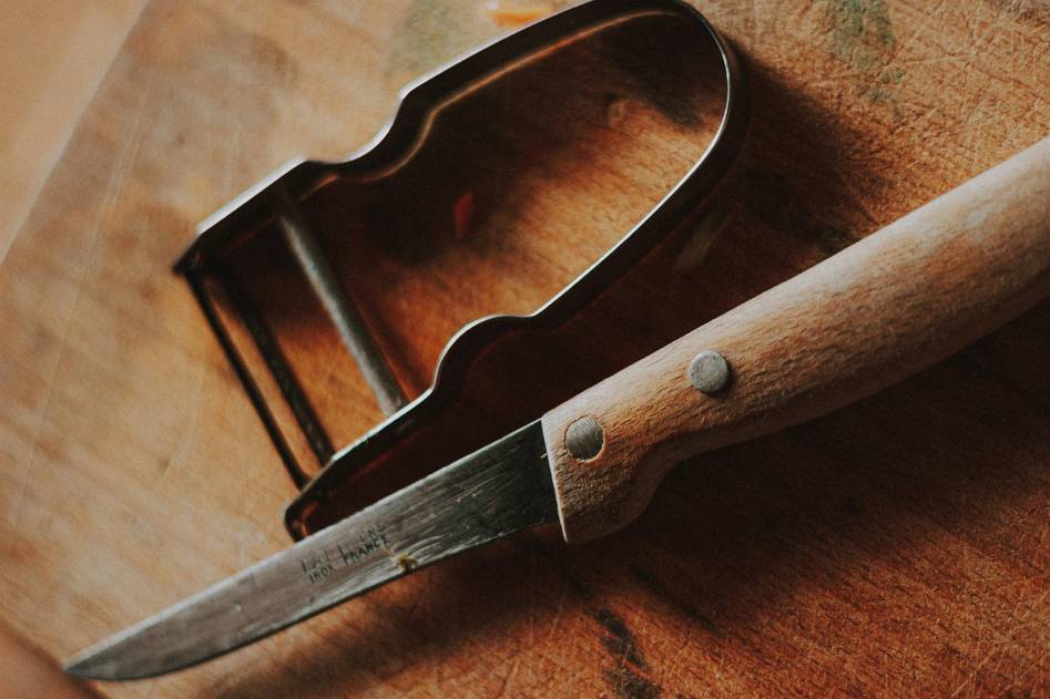 Two bloggers testing vegetable choppers in a bright, modern kitchen
